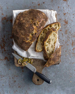 Jim Lahey’s no-knead olive bread from Sullivan Street bakery is made with flour, water, yeast, and olives and lets you create the bakery’s signature artisan loaf at home with very little effort.