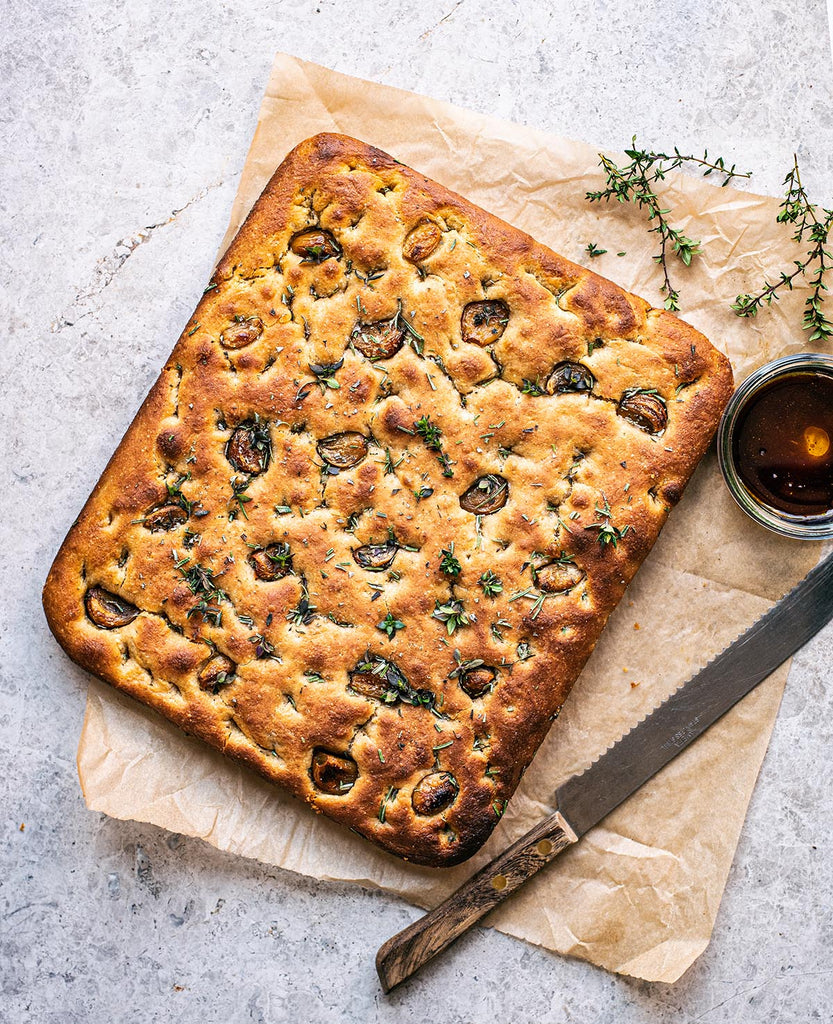 Sourdough focaccia is dimpled and golden on the outside, soft and chewy on the inside! It’s a simple bread where sourdough starter and olive oil shine.