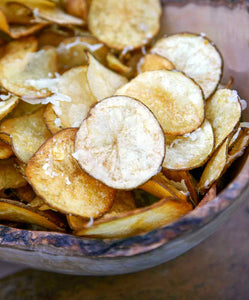 These Manchego potato chips are made by gilding store-bought or homemade potato chips with melted Manchego cheese